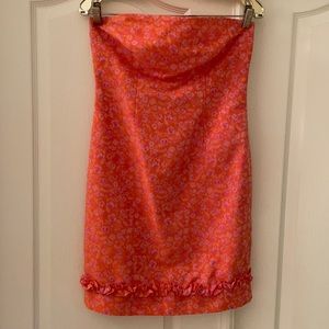 Strapless knee length Orange dress with Flower Print.